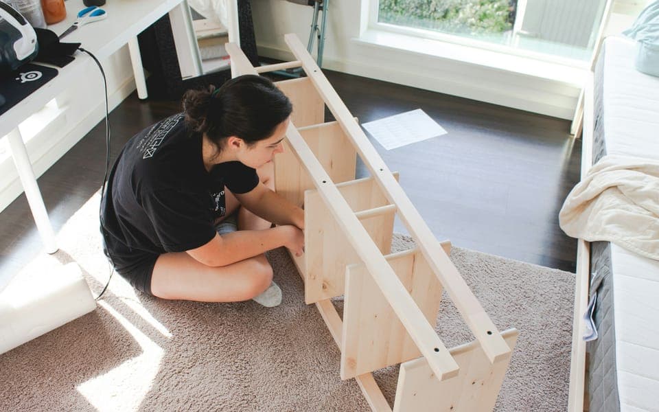 Wooden shelf being assembled on the floor
